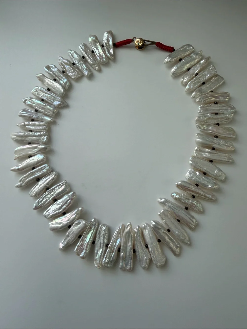 NWOT Roxanne Assoulin White Pearl Spike and Gold Charm Layered Necklace